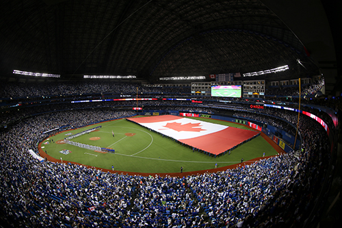 A giant Canadian flag is unfurled before #ALCS Game 3.