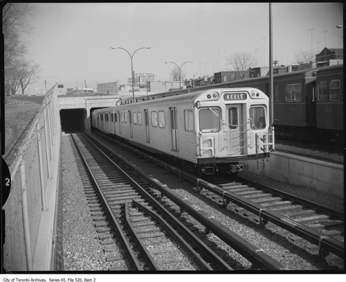 Series consists of photographs commmissioned by Metropolitan Toronto and City of Toronto government departments, government agencies (such as the TTC), and a small number of private clients (such as the construction firms Fenco Harris and MM Dillon) to document certain of their activities. Many of the images were commissioned by the Metro Roads and Traffic Department and are of roads and bridges, both under construction and in use. The construction of roads to link the new postwar suburbs in Etobicoke, North York, and Scarborough with the city core is well represented here.Some of the better represented roads are Avenue Rd., Bathurst St., Bayview Ave., Don Mills Rd., Don Valley Parkway, Dufferin St., Eglinton Ave., Gardiner Expressway, Keele St., Kennedy Rd., Lawrence Ave., Victoria Park Ave., and Wilson Ave.;Many images also document the interiors and exteriors of houses, apartments, and stores that were slated for destruction or otherwise affected by municipal projects such as TTC subway construction. Several businesses are thoroughly documented inside and out, including a restaurant, a drug store, and a used car dealership. As well, many downtown and midtown streets are shown, particularly in the Alexandra Park area east of downtown. Snow removal and garbage disposal services are also shown, including extensive documentation of the Commissioners Street Incinerator and of garbage and street cleaning trucks.