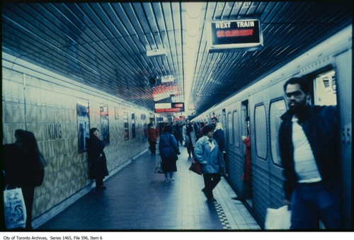 File consists of slides depicting older model streetcars along Queen St near Queen's Quay.