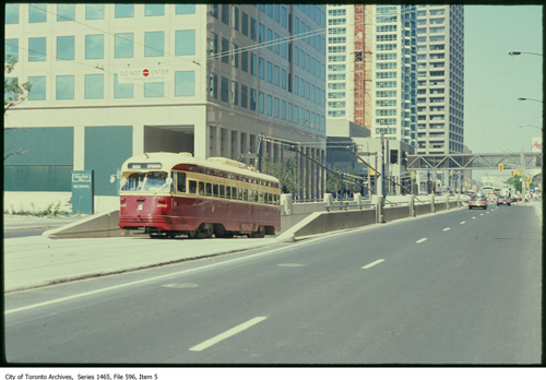 File consists of slides depicting older model streetcars along Queen St near Queen's Quay.